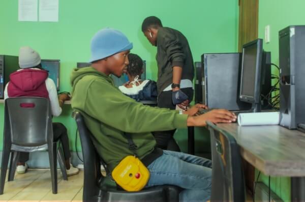 Group of learners working on computers.